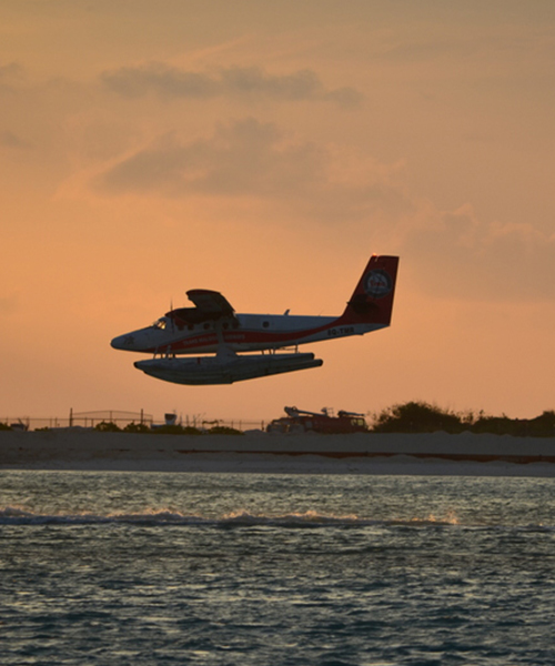 _0003_sea plane against sunset male maldives landing